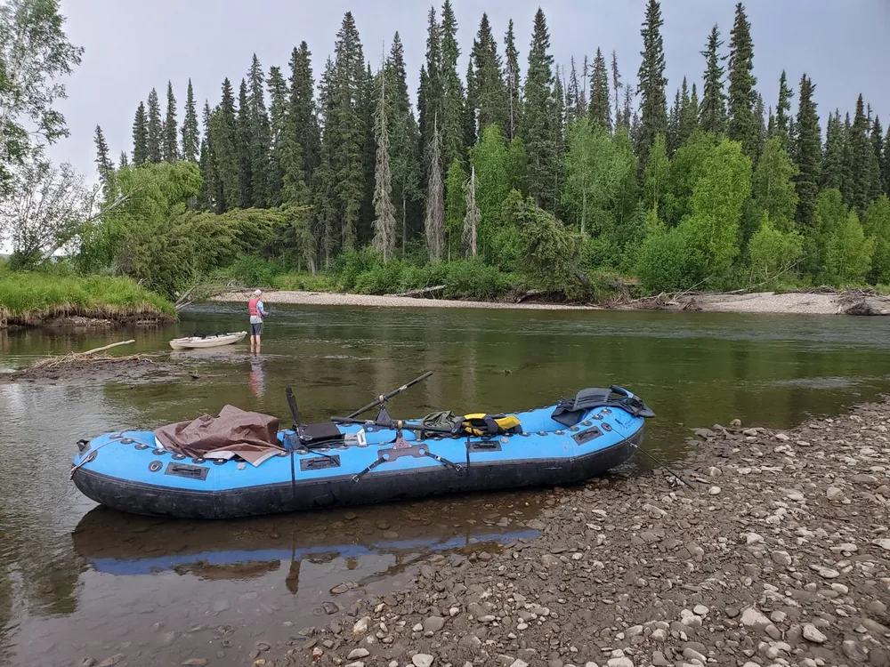 Inflatable raft on a gravel river bar in Alaska
